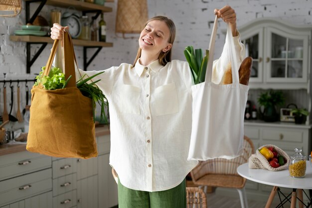 Front view smiley woman with bags