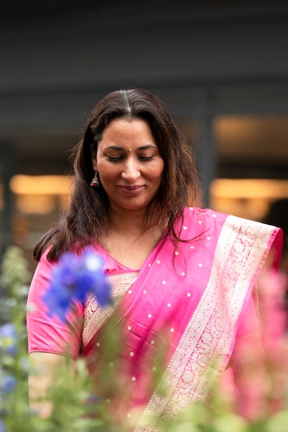 Free photo front view smiley woman with sari