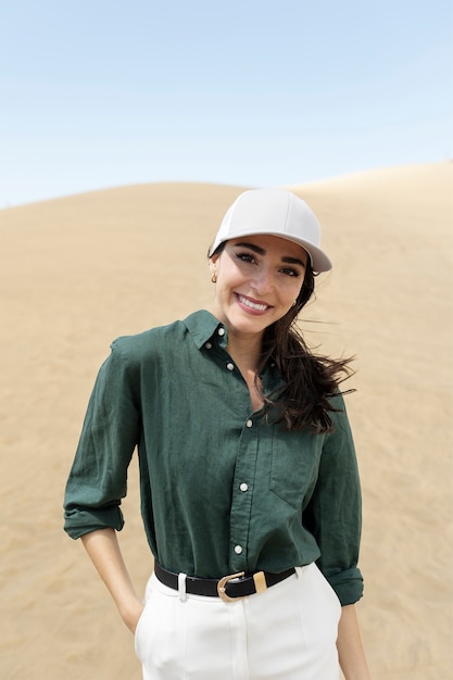 Front view smiley woman with trucker hat