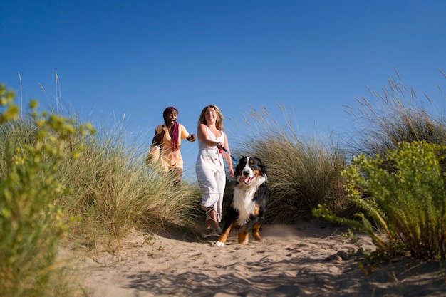 Front view smiley women with cute dog