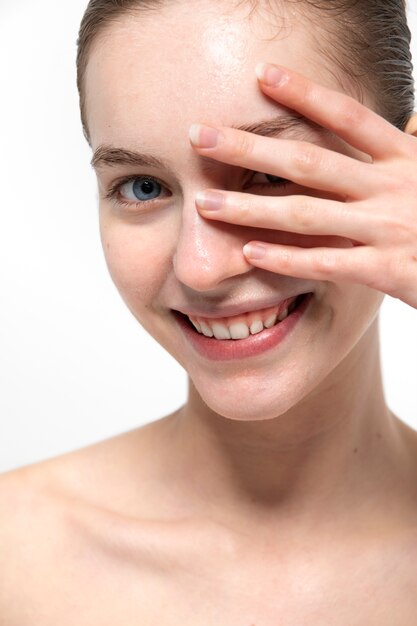 Front view smiley young woman with clear skin