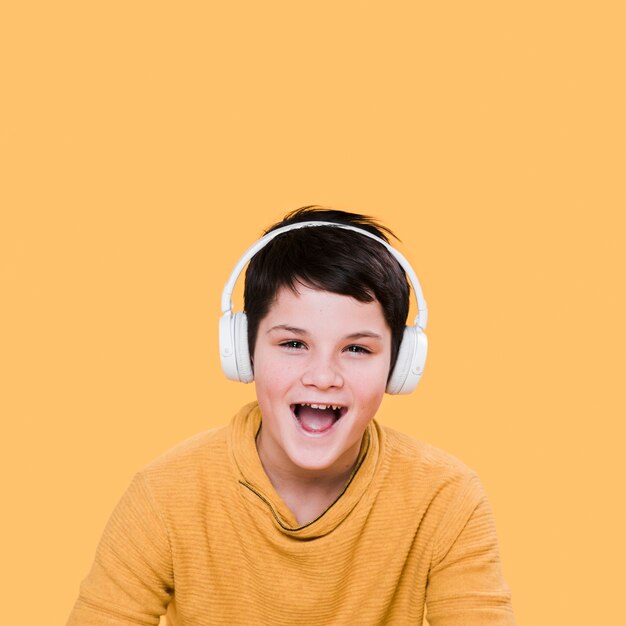 Front view of smiling boy with headphones