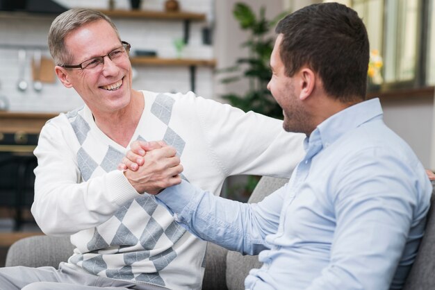 Front view of smiling father and son