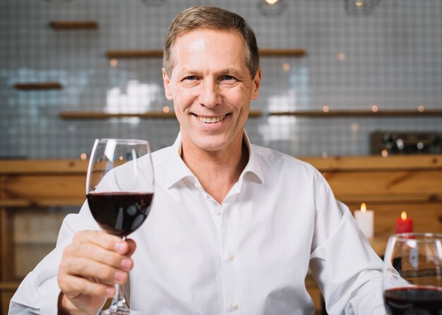 Front view of smiling man at dinner