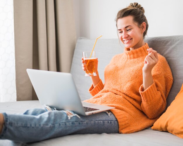 Front view of smiling sitting on couch