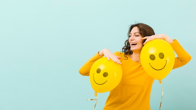 Front view of smiling woman with copy space