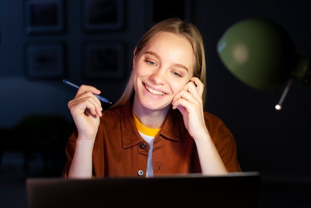 Free photo front view of smiling woman working