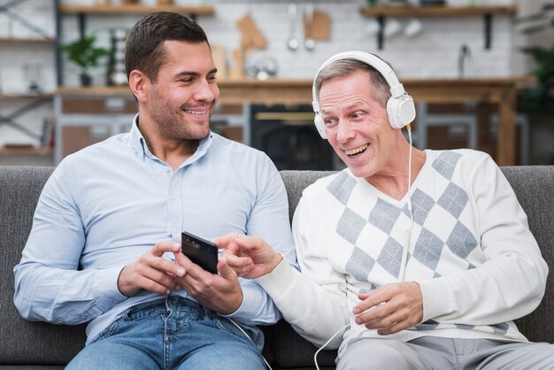 Front view of son and father playing music