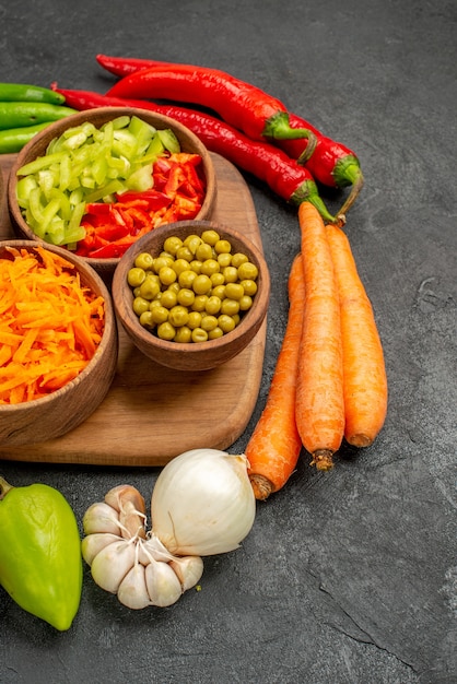 Front view spicy peppers with beans on a dark table color salad ripe fresh