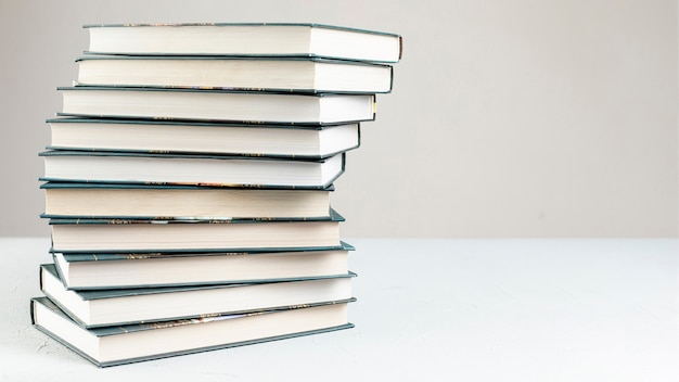 Free photo front view spiral stacked books