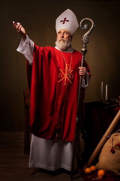 Free photo front view st nicholas holding cane