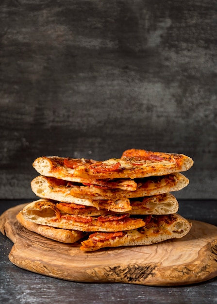 Front view stack of pizzas