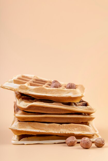 Front view of stack of waffles with hazelnuts