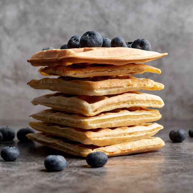 Front view of stacked waffles with blueberries on top