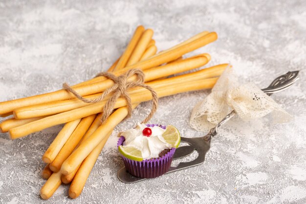 Front view stick crackers with brownie on white