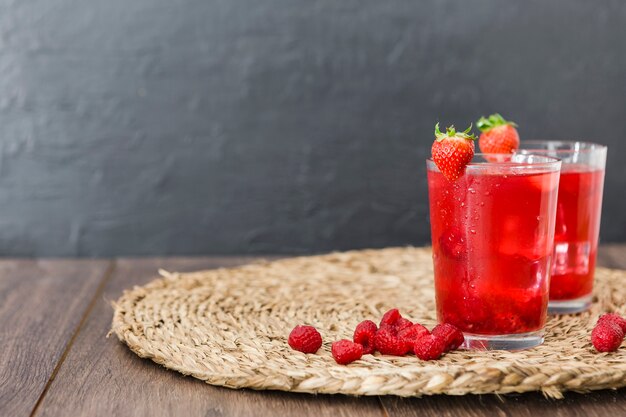 Front view of strawberry cocktails with copy space