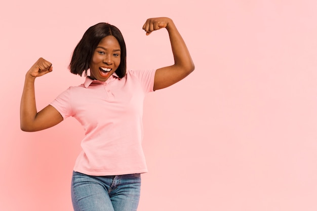 Free photo front view strong woman in studio