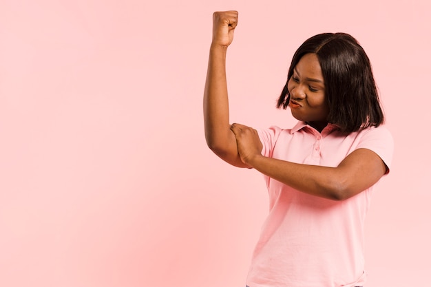 Front view strong woman in studio