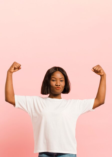 Front view strong woman in studio