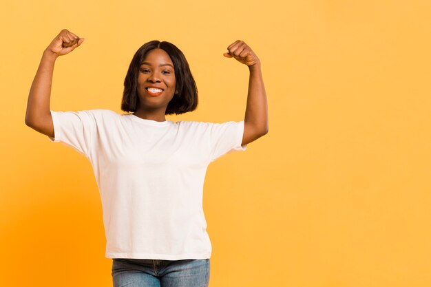 Front view strong woman in studio