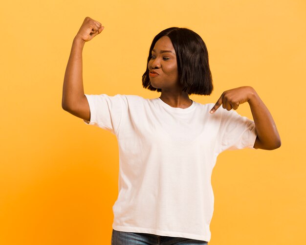 Front view strong woman in studio