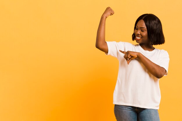 Front view strong woman in studio