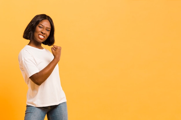 Free photo front view strong woman in studio