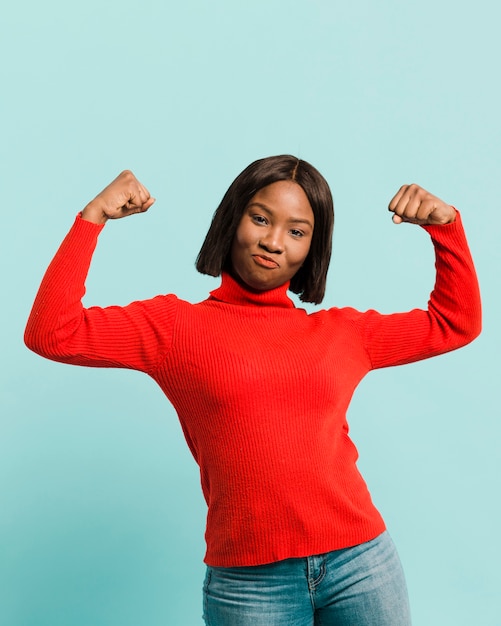 Free photo front view strong woman in studio