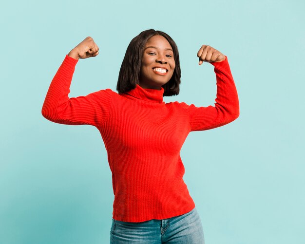 Front view strong woman in studio