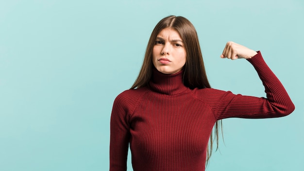 Front view strong woman in studio