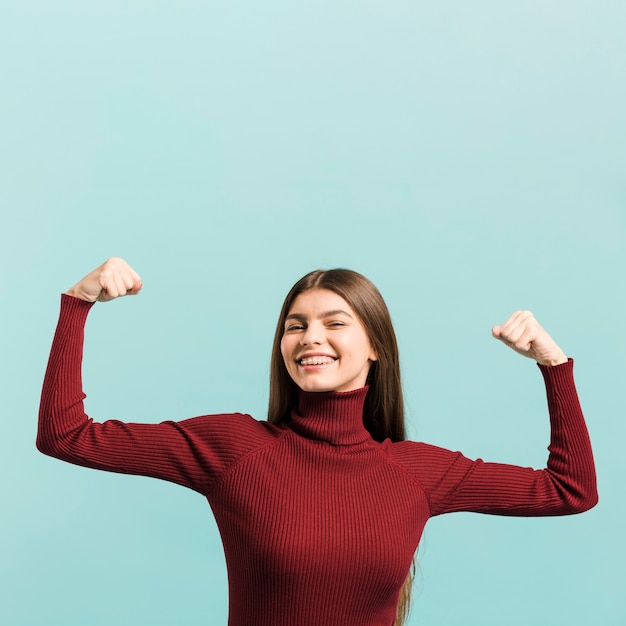 Front view strong woman in studio