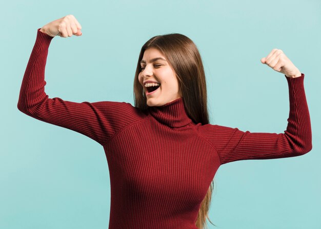 Front view strong woman in studio