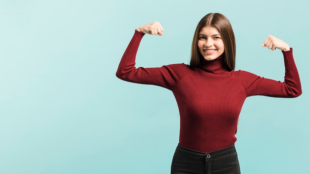 Front view strong woman in studio