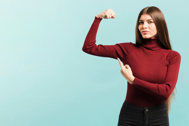 Front view strong woman in studio