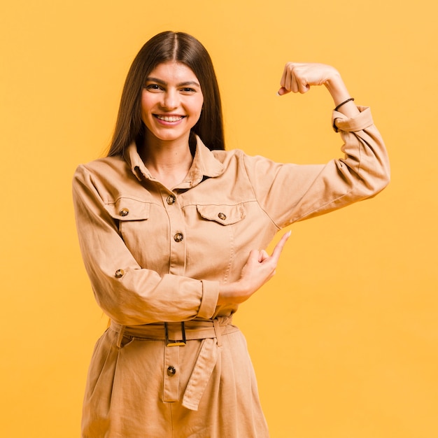 Front view strong woman in studio