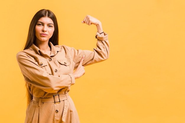 Free photo front view strong woman in studio