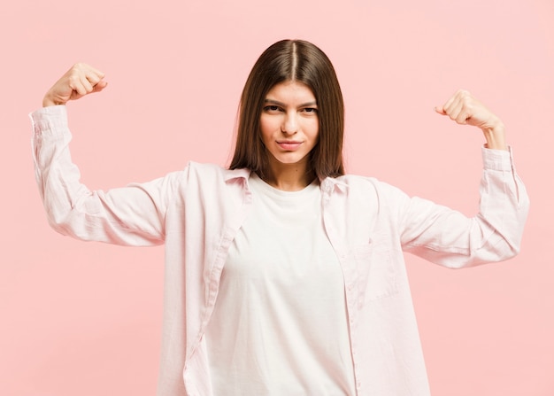 Front view strong woman in studio