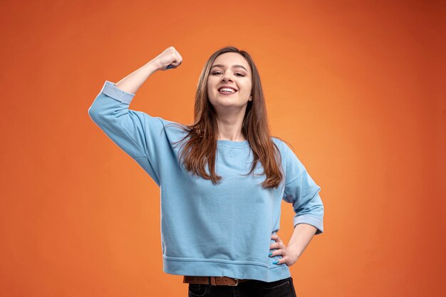 Front view of strong woman with bicep