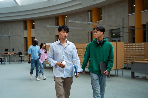 Front view students walking together