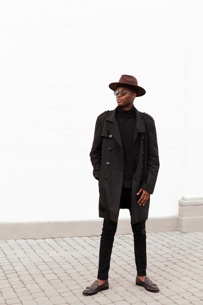 Front view stylish male with hat and sunglasses