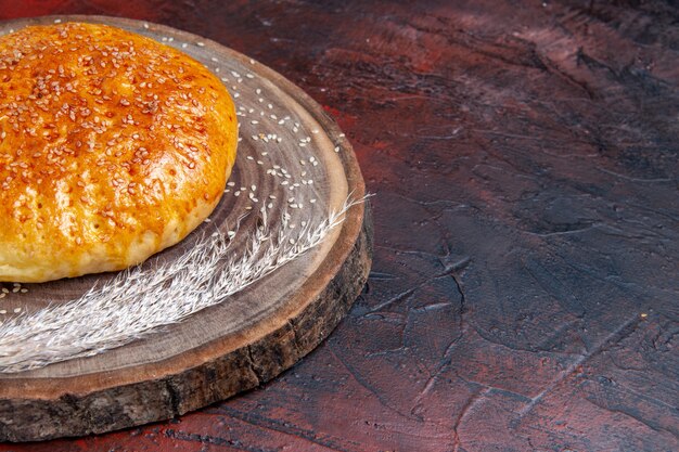 Front view sweet baked bun bread like fresh bread on a dark background