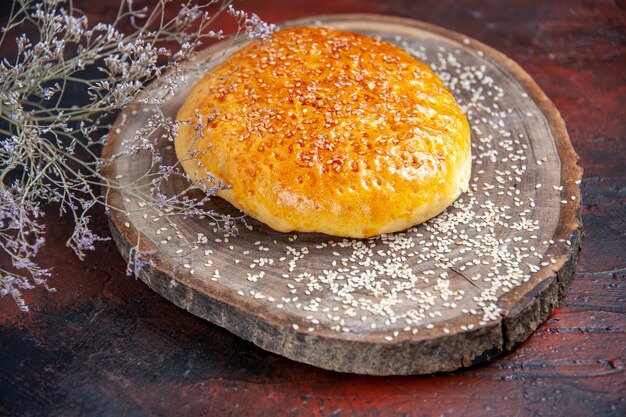 Front view sweet baked bun bread like fresh bread on the dark background