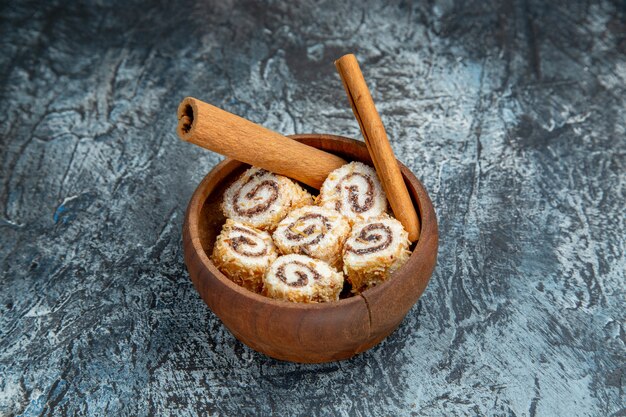 Front view of sweet nougat with cinnamon on dark surface