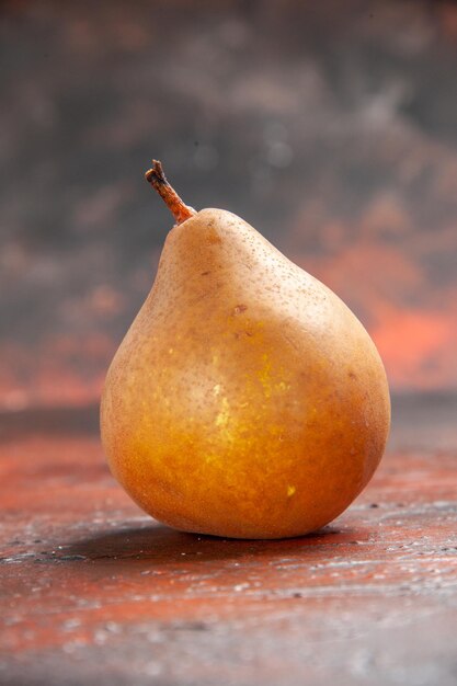 Front view sweet pear on a dark background