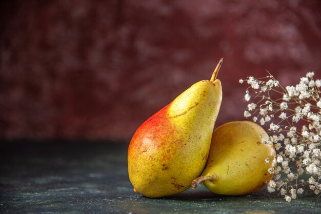 Front view sweet pears on the dark background mellow tree fresh apple color juice ripe pulp