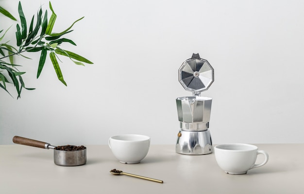 Front view of table with coffee cup and kettle