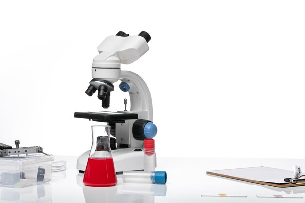 Front view table with solutions and microscope on white space