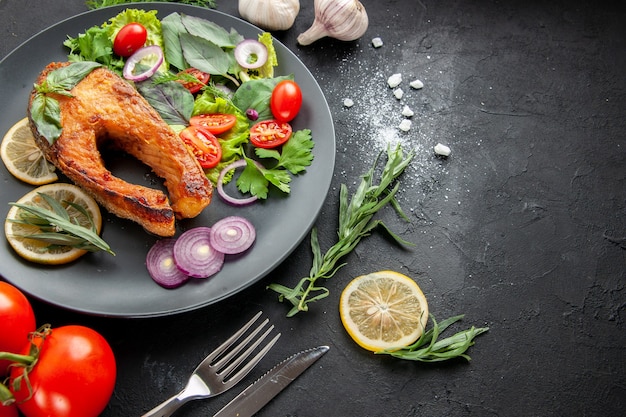 Front view tasty cooked fish with fresh vegetables on dark background photo seafood food dish meat color