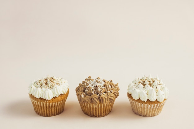 Front view tasty cupcakes of different flavours