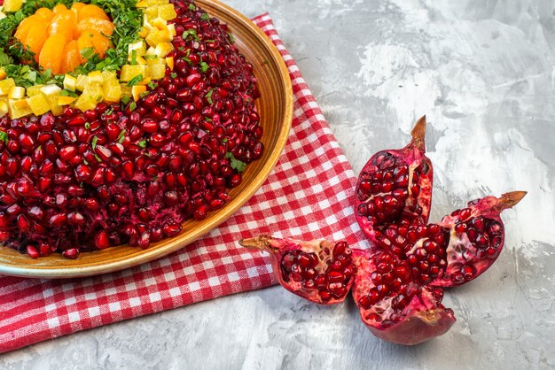 Front view tasty pomegranate salad on white